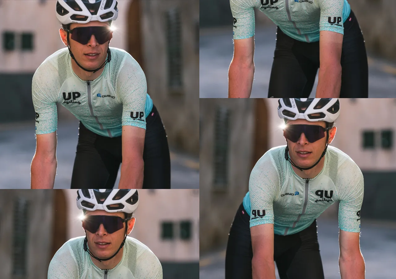 A cyclist wearing a light blue patterned jersey with the 'UP cycling' logo and the brand name 'owayo' on the chest, riding a bicycle.